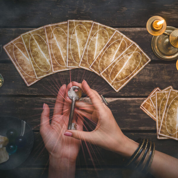 Tarot cards on fortune teller desk table background. Magic key t